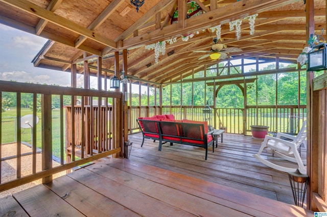 sunroom / solarium with an outdoor living space and ceiling fan