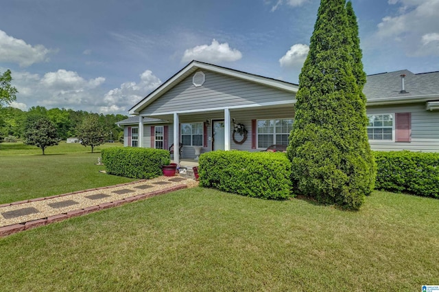 view of front of house with covered porch and a front yard
