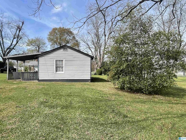 view of side of property with a lawn