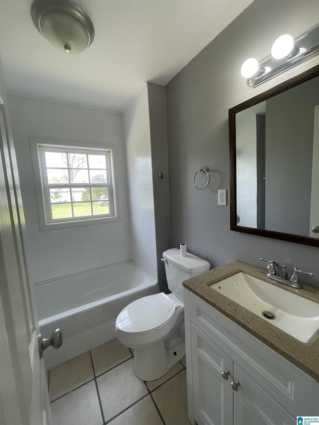 bathroom with toilet, tile patterned floors, a bathtub, and vanity