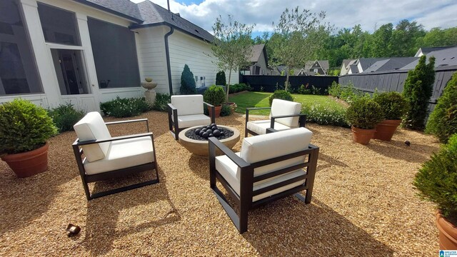 1308 Severn Way, Hoover, AL 35244 - view of patio / terrace featuring fence and an outdoor living space with a fire pit