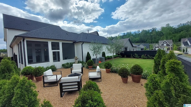 1308 Severn Way, Hoover, AL 35244 - rear view of house featuring a shingled roof, a yard, an outdoor living space, a sunroom, and central AC