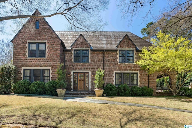 4603 Clairmont Ave, Birmingham, AL 35222 - tudor home featuring brick siding and a front lawn
