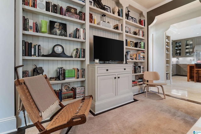 4603 Clairmont Ave, Birmingham, AL 35222 - living area with carpet floors, built in shelves, and crown molding