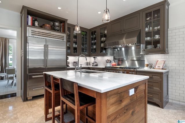 4603 Clairmont Ave, Birmingham, AL 35222 - kitchen with open shelves, stainless steel appliances, under cabinet range hood, a sink, and dark brown cabinetry