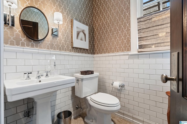4603 Clairmont Ave, Birmingham, AL 35222 - bathroom featuring wallpapered walls, a wainscoted wall, and toilet