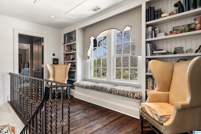 4603 Clairmont Ave, Birmingham, AL 35222 - living area with dark wood-style flooring, an upstairs landing, visible vents, crown molding, and built in shelves