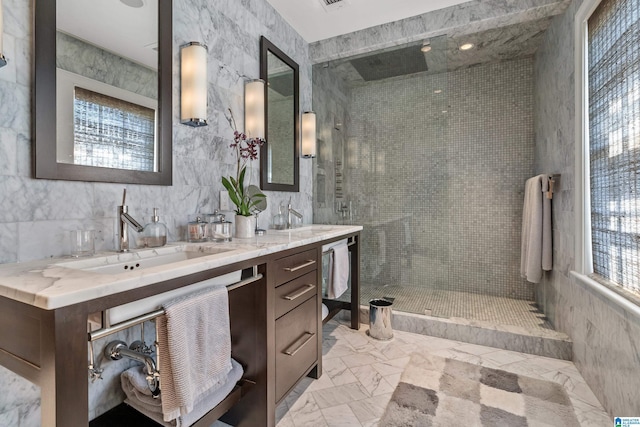 4603 Clairmont Ave, Birmingham, AL 35222 - full bathroom featuring tile walls, marble finish floor, a sink, double vanity, and a walk in shower