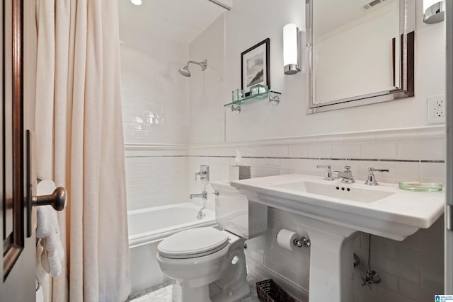 4603 Clairmont Ave, Birmingham, AL 35222 - full bathroom with tile walls, a wainscoted wall, visible vents, toilet, and shower / bathtub combination with curtain