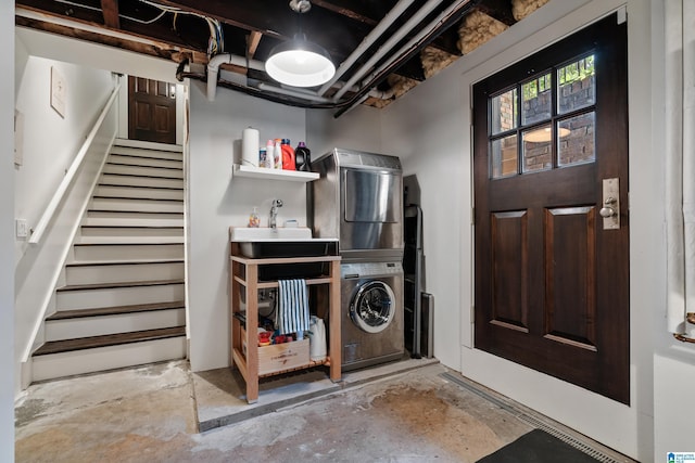 4603 Clairmont Ave, Birmingham, AL 35222 - washroom featuring a sink, stacked washing maching and dryer, and laundry area