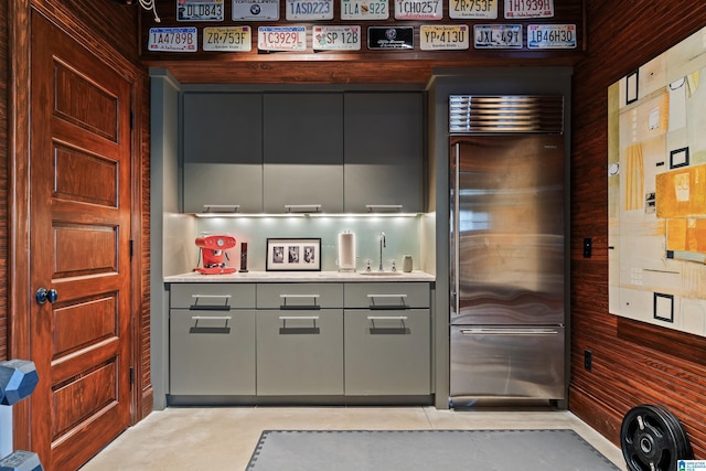 4603 Clairmont Ave, Birmingham, AL 35222 - bar with light tile patterned floors, a sink, and wooden walls