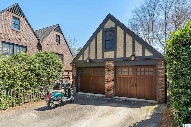 4603 Clairmont Ave, Birmingham, AL 35222 - garage featuring fence and a garage