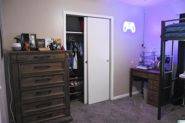bedroom featuring a closet and dark colored carpet