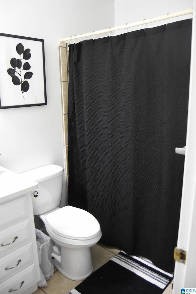 full bath with curtained shower, toilet, tile patterned flooring, and vanity
