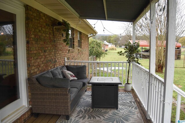 wooden deck with an outdoor hangout area