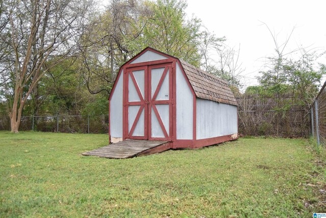 view of shed with a fenced backyard