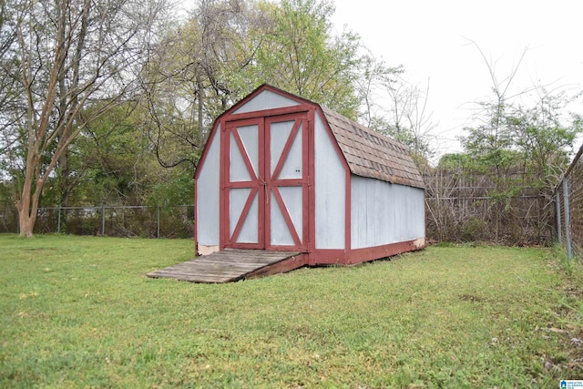 view of shed with a fenced backyard