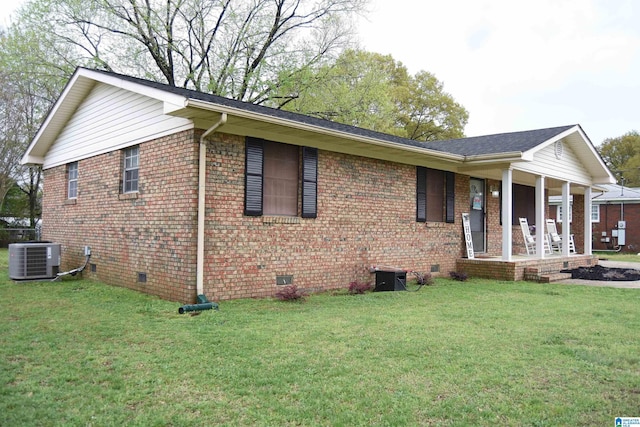 view of property exterior with crawl space, central AC, and brick siding