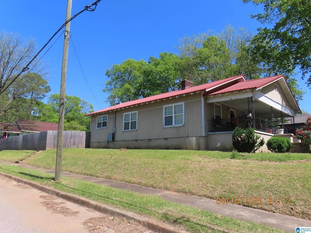 4255 Pulaski St, Birmingham, AL 35217 - view of side of home with crawl space, a yard, and fence