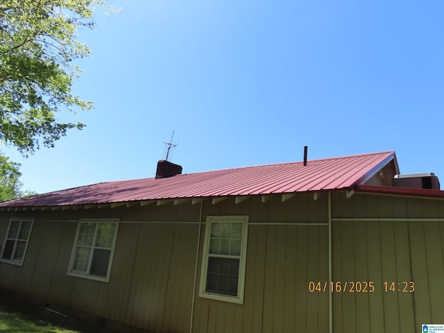 4255 Pulaski St, Birmingham, AL 35217 - view of property exterior with metal roof and central AC