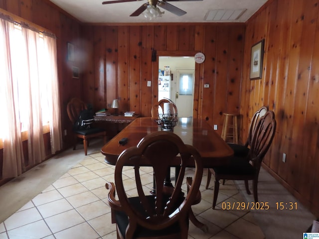 4255 Pulaski St, Birmingham, AL 35217 - dining room featuring wooden walls, visible vents, light tile patterned floors, and ceiling fan