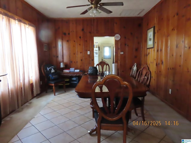 4255 Pulaski St, Birmingham, AL 35217 - dining room with light tile patterned flooring, ceiling fan, and wooden walls