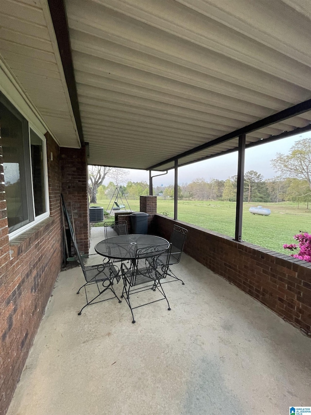 view of patio / terrace featuring outdoor dining area and central AC unit
