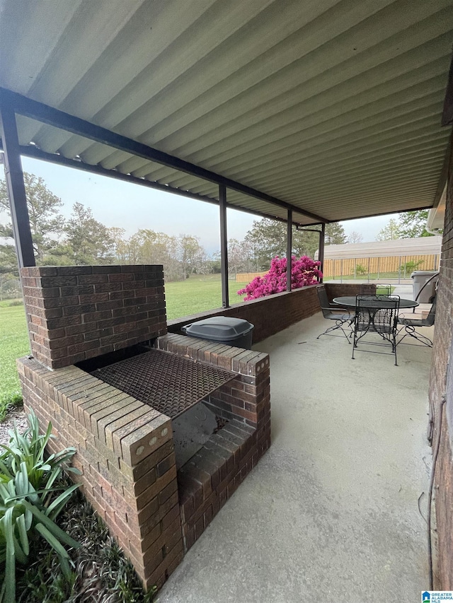 view of patio featuring outdoor dining area and fence