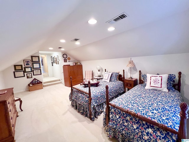 bedroom featuring light carpet, visible vents, recessed lighting, and vaulted ceiling