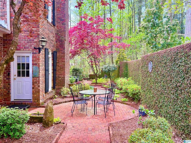 view of patio featuring fence