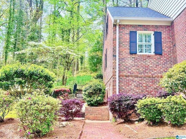 view of home's exterior featuring brick siding