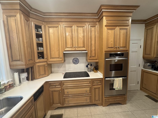kitchen featuring light tile patterned flooring, black electric cooktop, a sink, and stainless steel double oven