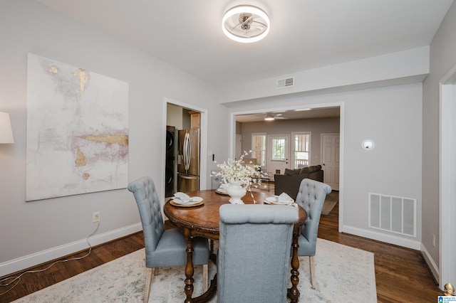 1101 26th St S Unit 202, Birmingham, AL 35205 - dining room featuring baseboards, visible vents, and wood finished floors