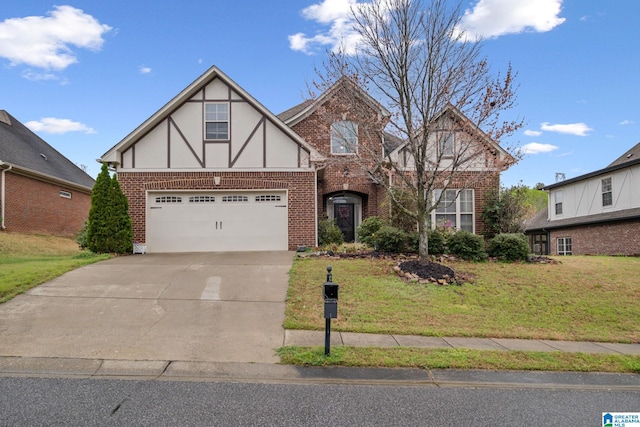 471 River Oaks Ln, Helena, AL 35080 - tudor home with brick siding, concrete driveway, a front lawn, and stucco siding