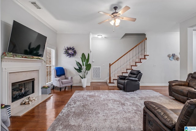 471 River Oaks Ln, Helena, AL 35080 - living area with stairs, ceiling fan, a high end fireplace, wood finished floors, and crown molding