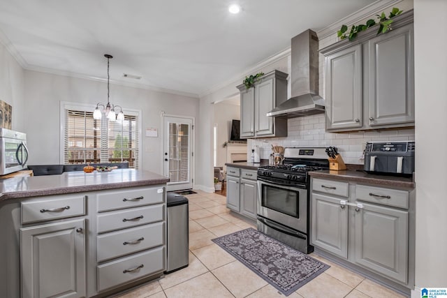 471 River Oaks Ln, Helena, AL 35080 - kitchen featuring stainless steel appliances, wall chimney exhaust hood, gray cabinets, a chandelier, and decorative backsplash