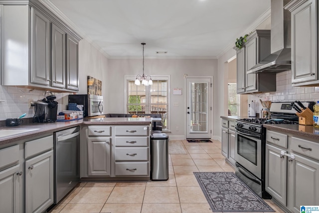 471 River Oaks Ln, Helena, AL 35080 - kitchen with stainless steel appliances, wall chimney exhaust hood, gray cabinetry, a chandelier, and ornamental molding