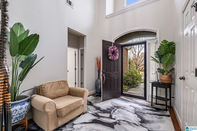 471 River Oaks Ln, Helena, AL 35080 - foyer with baseboards, a towering ceiling, and wood finished floors