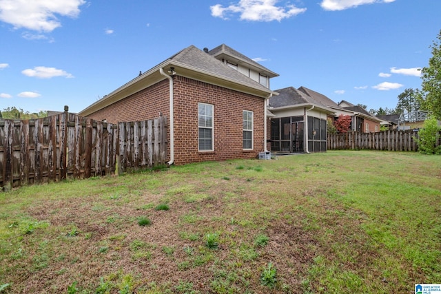 471 River Oaks Ln, Helena, AL 35080 - rear view of house featuring brick siding and a sunroom