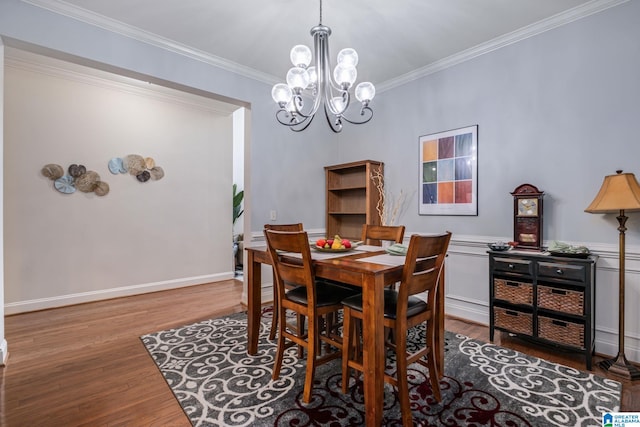 471 River Oaks Ln, Helena, AL 35080 - dining area with wood finished floors, a chandelier, and crown molding