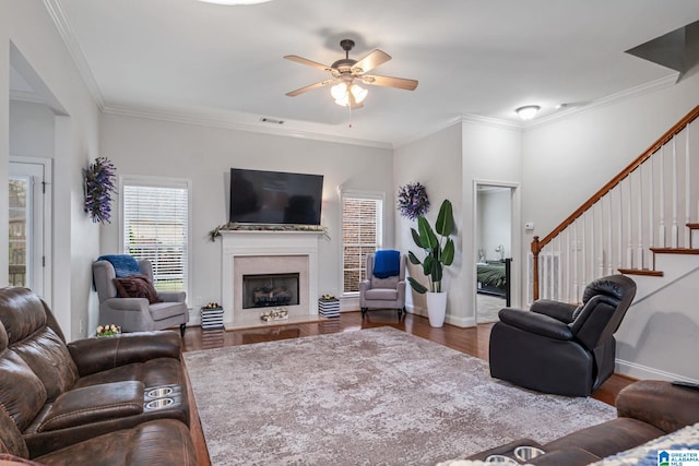 471 River Oaks Ln, Helena, AL 35080 - living room featuring ceiling fan, stairs, crown molding, a fireplace, and baseboards