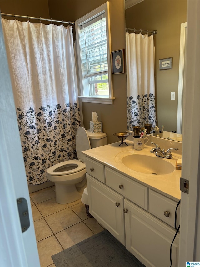 bathroom with tile patterned flooring, vanity, curtained shower, and toilet