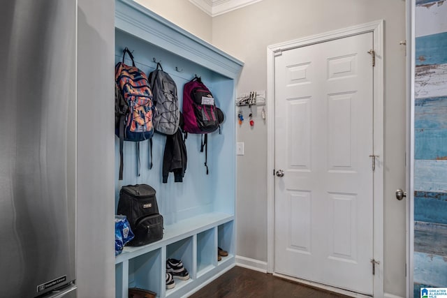 mudroom featuring ornamental molding, baseboards, and dark wood-style floors
