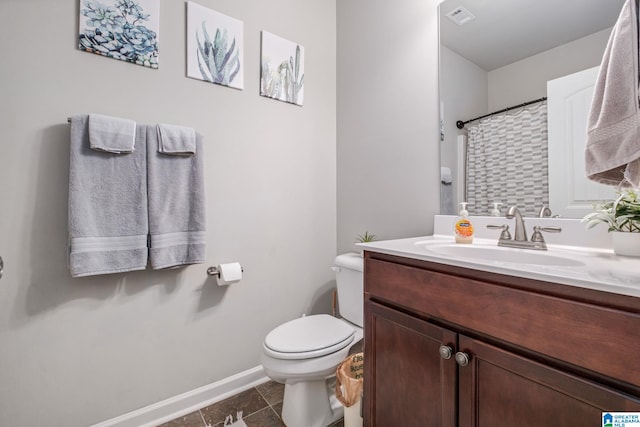 full bathroom with vanity, baseboards, tile patterned floors, toilet, and visible vents