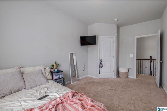 bedroom featuring carpet flooring and baseboards