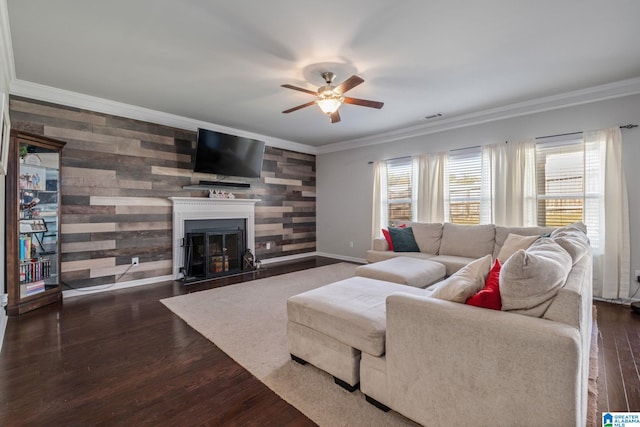 living room featuring crown molding, visible vents, ceiling fan, and dark wood-style floors