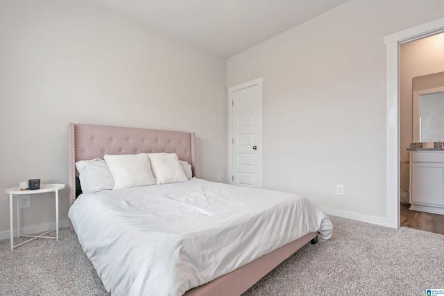 bedroom with baseboards and carpet flooring