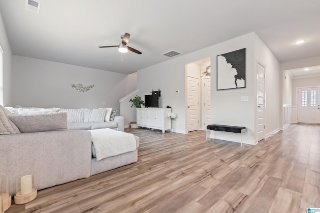 living area with ceiling fan, visible vents, recessed lighting, and light wood finished floors