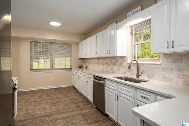 1324 W Navajo Dr, Alabaster, AL 35007 - kitchen with a sink, light countertops, stainless steel dishwasher, and white cabinetry