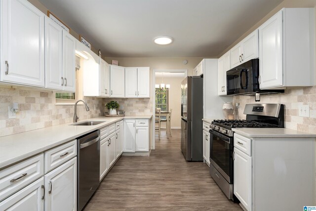 1324 W Navajo Dr, Alabaster, AL 35007 - kitchen with a sink, decorative backsplash, appliances with stainless steel finishes, and white cabinetry